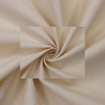 A close-up of draped fabric in a warm light beige or cream tone, arranged in a spiral with a rectangular inset showing the material texture and color.