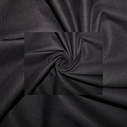 Black fabric draped in a central spiral pattern, showing a smooth texture and subtle sheen.