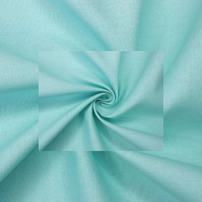 A close-up of light aqua fabric with a central swirled inset showing the material texture and color.