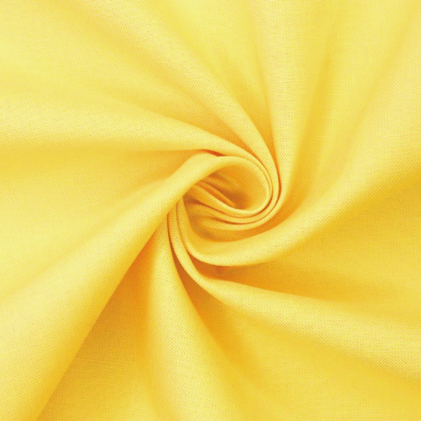 A close-up of bright yellow fabric arranged in a spiral drape, showing the material texture and color.