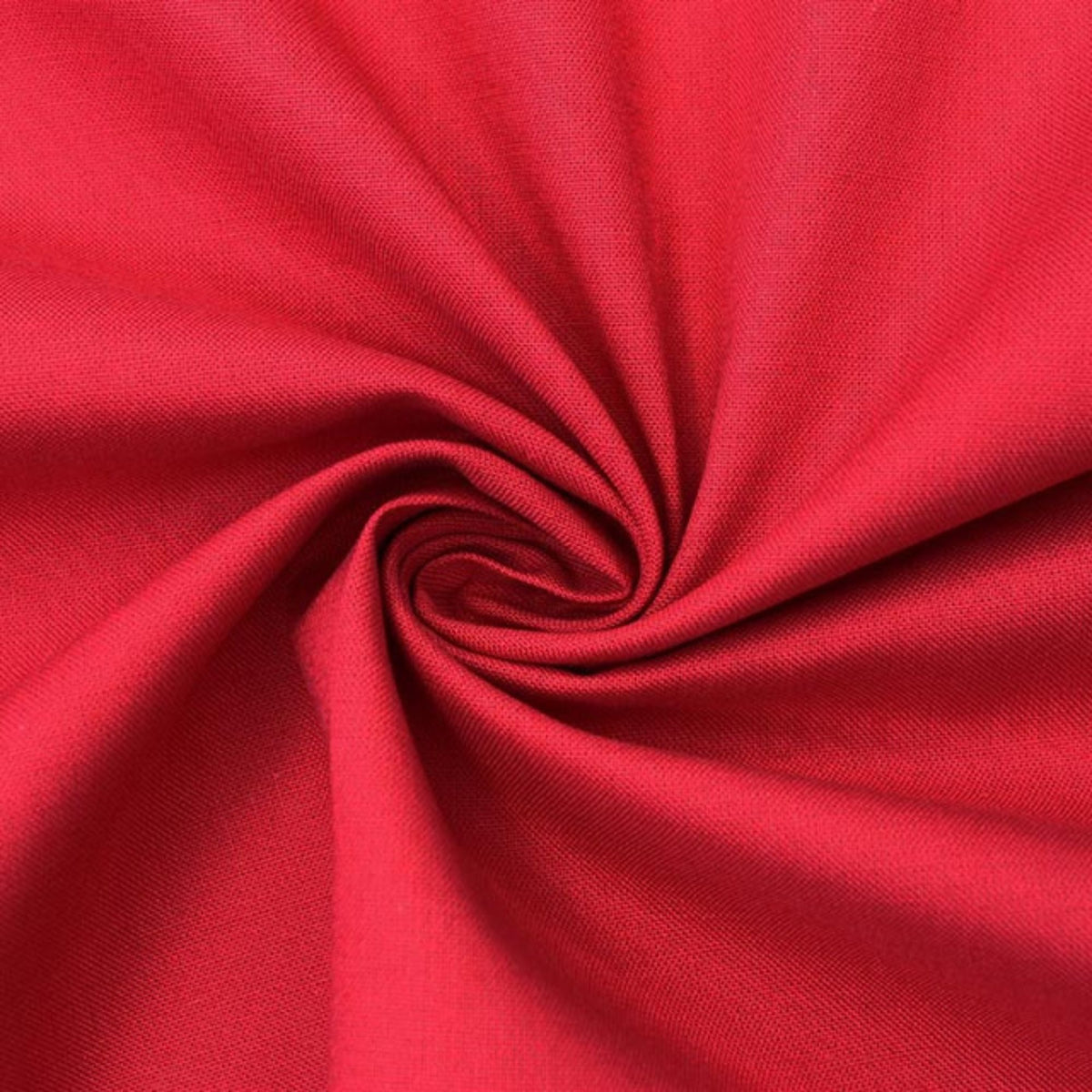 A close-up of bright red fabric arranged in a spiral drape, showing the material texture and color.