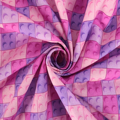 A repeating pattern of pink and purple toy building-block studs filling the frame, with no person, animal, or real environment visible.